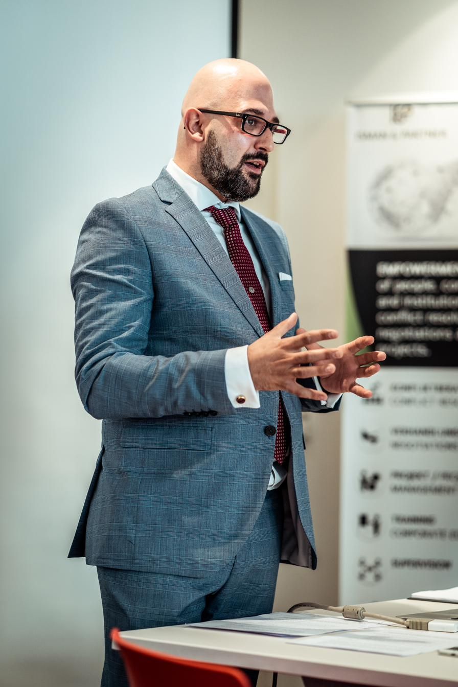 Mihai Isman giving a talk on negotiation leadership